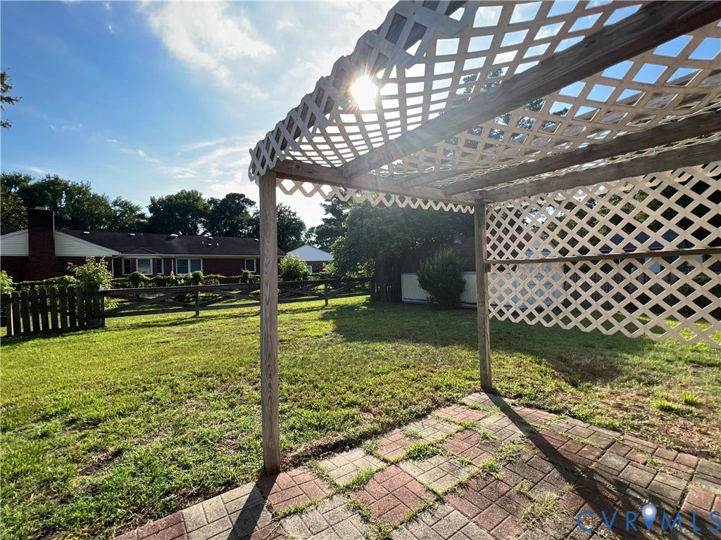 2112 Paramont Avenue, Collegue Park, Chesapeake, VA 23320 Brick paver patio with a lattice pergola and a spacious lawn