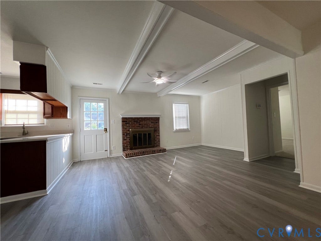 2112 Paramont Avenue, Collegue Park, Chesapeake, VA 23320 Wood-finish flooring throughout, brick-surround fireplace, ceiling fan, coffered ceiling, and white paneling