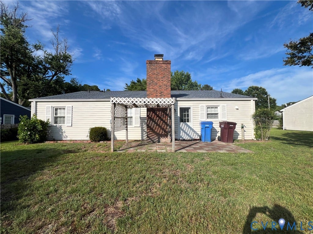 2112 Paramont Avenue, Collegue Park, Chesapeake, VA 23320 Rear exterior with light-colored siding, a brick chimney, and a paved patio area