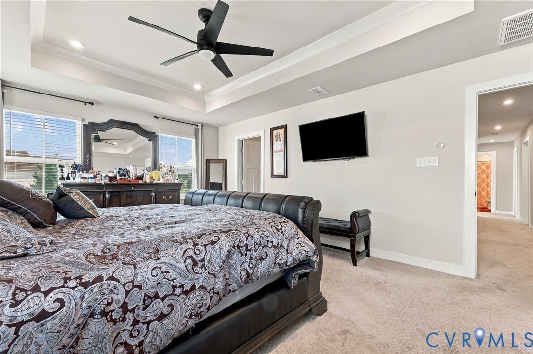 Tray ceiling with recessed lighting and a ceiling fan