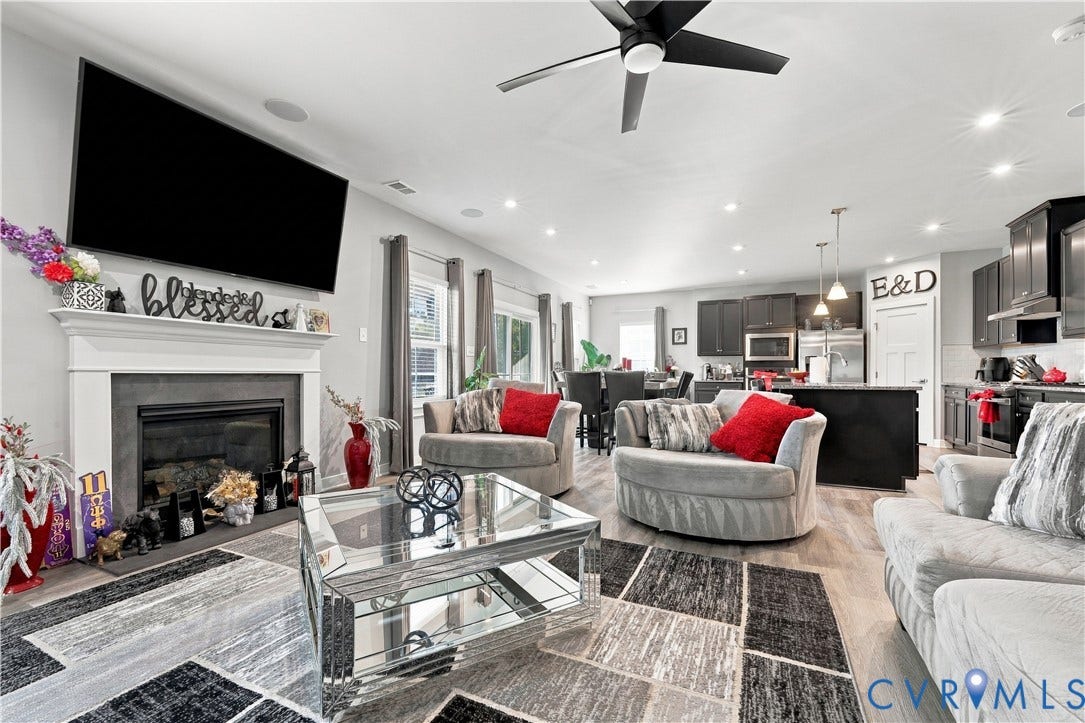 Open-concept living space with wood-finish flooring