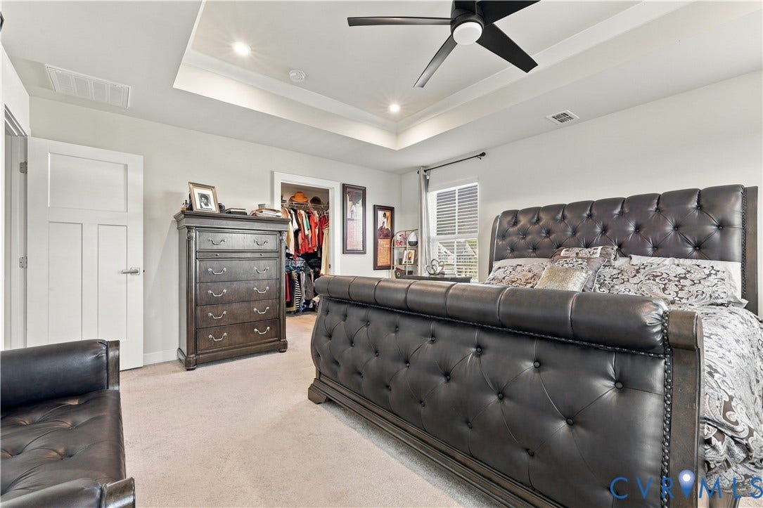 Tray ceiling with recessed lighting and a ceiling fan