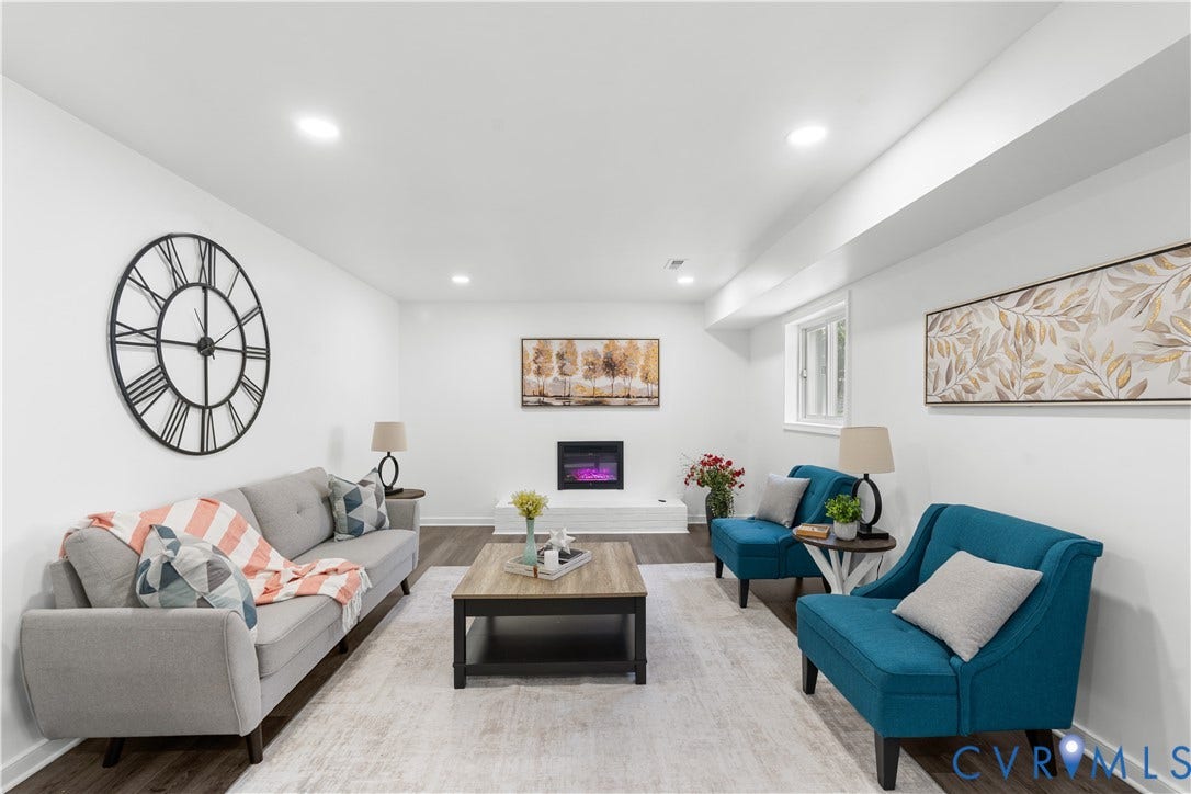 4911 Aqua Lane, Prince George, VA 23875 Recessed lighting illuminates the wood-finish flooring and white walls