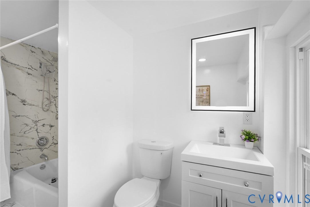 4911 Aqua Lane, Prince George, VA 23875 White vanity with under-sink storage, integrated sink, and chrome faucet