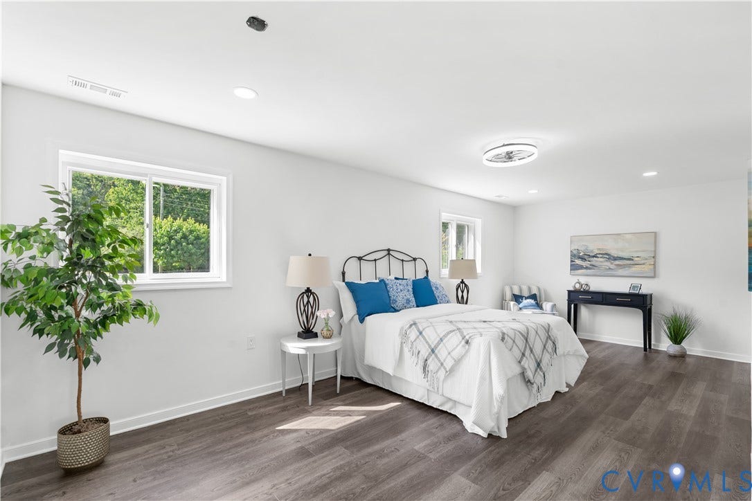 4911 Aqua Lane, Prince George, VA 23875 Recessed lighting, wood-finish flooring, white walls, multiple windows, and a ceiling-mounted light fixture