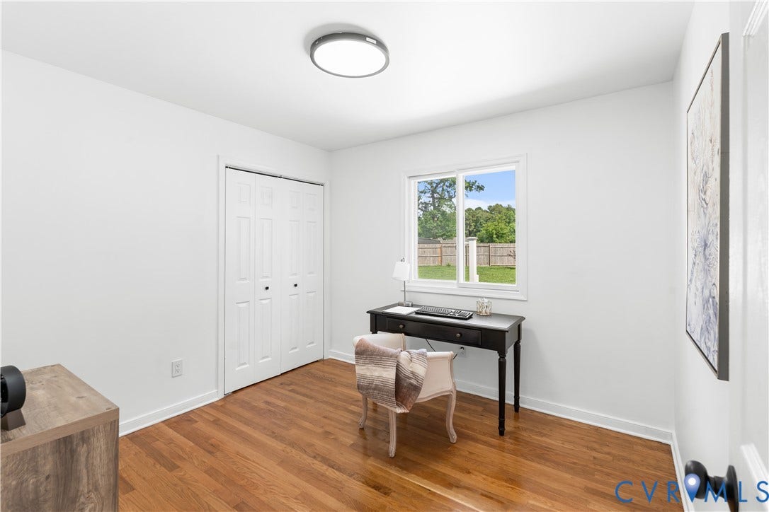 4911 Aqua Lane, Prince George, VA 23875 Hardwood flooring, white walls, recessed lighting, double bi-fold closet, and a window with exterior views