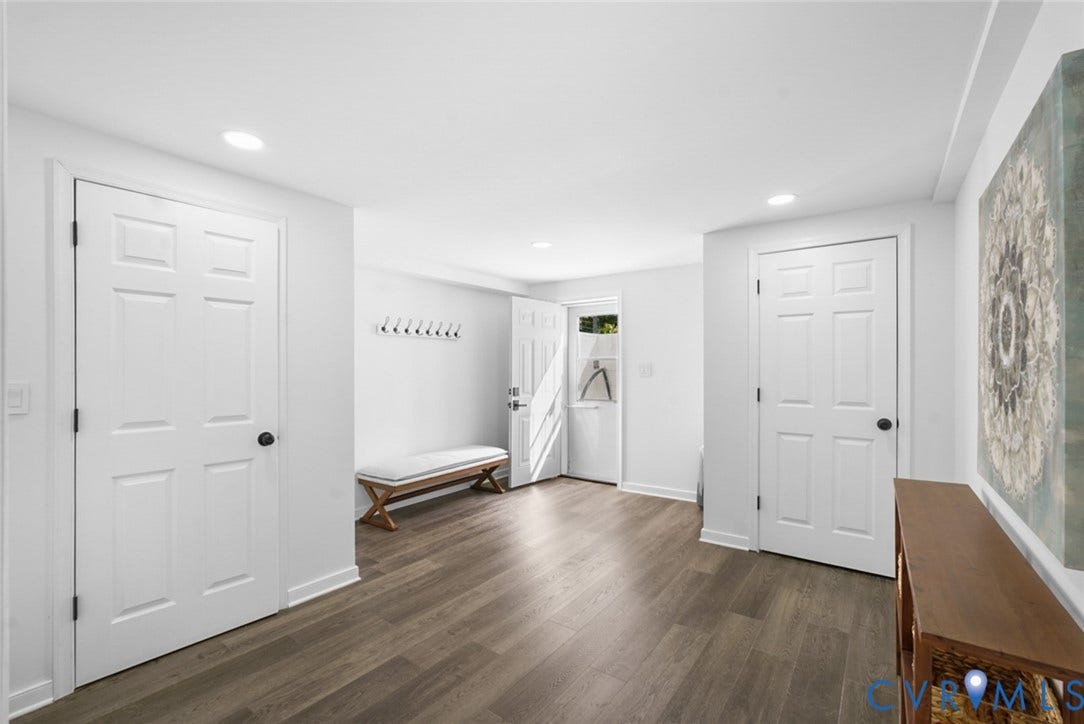 4911 Aqua Lane, Prince George, VA 23875 Wood-finish flooring, recessed lighting, white panel doors, and a built-in coat rack
