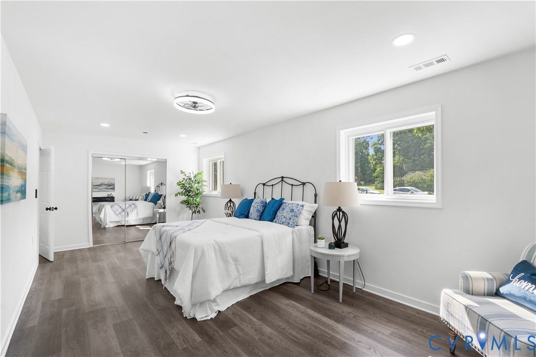 4911 Aqua Lane, Prince George, VA 23875 Wood-finish flooring throughout, white walls, recessed lighting, and a ceiling fan with integrated lighting