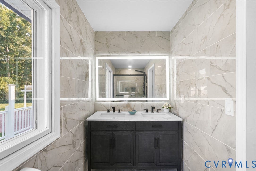 4911 Aqua Lane, Prince George, VA 23875 Double vanity with integrated sinks, dark wood-finish cabinetry, and matte black fixtures