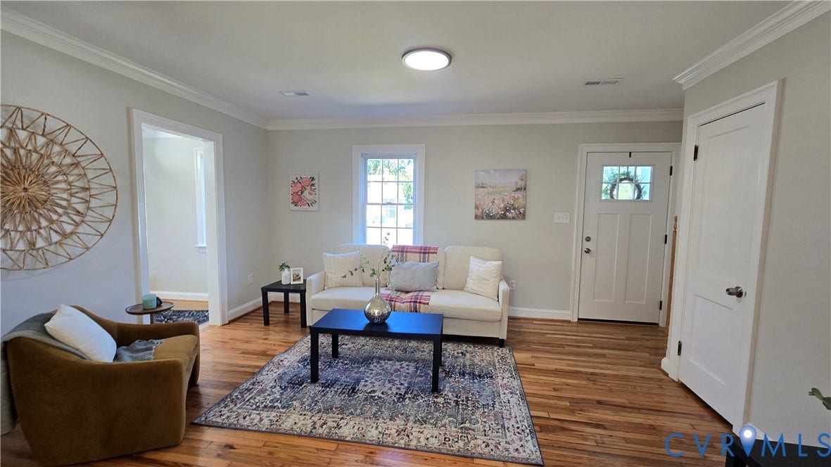 Hardwood flooring, recessed lighting, white trim, crown molding, and a paneled entry door with frosted glass