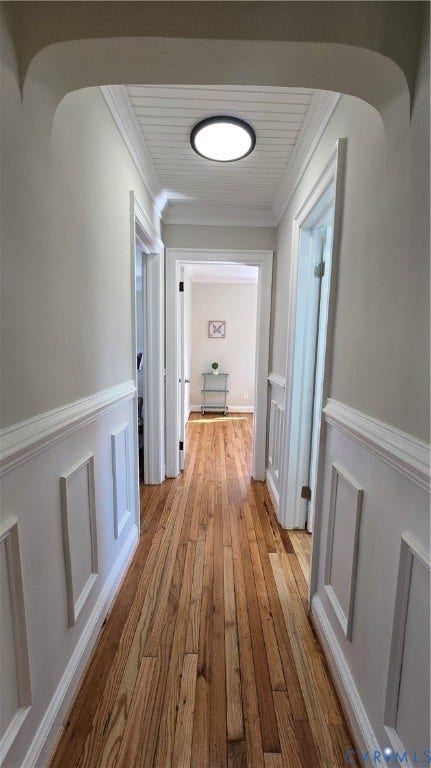 Wood-finish flooring with wainscoting and crown molding