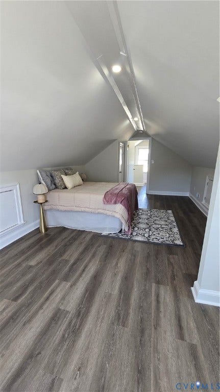 Wood-finish flooring throughout, recessed lighting, white trim, and sloped ceilings