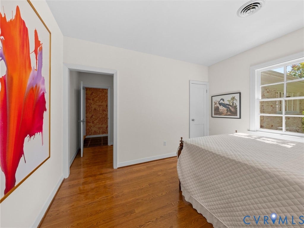 6208 Tapoan Place, Three Chopt, Richmond, VA 23226 Hardwood flooring throughout, white trim, white paneled doors, and a large window with multiple panes