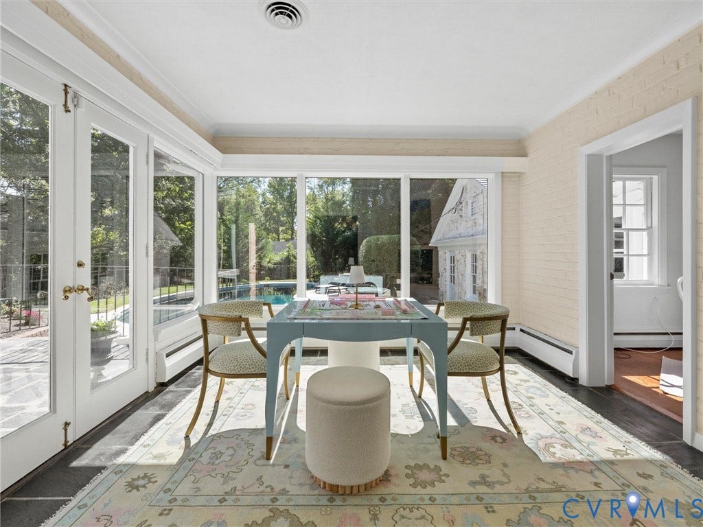 6208 Tapoan Place, Three Chopt, Richmond, VA 23226 Room featuring extensive floor-to-ceiling windows, French doors, dark tile flooring, and light-colored brick walls