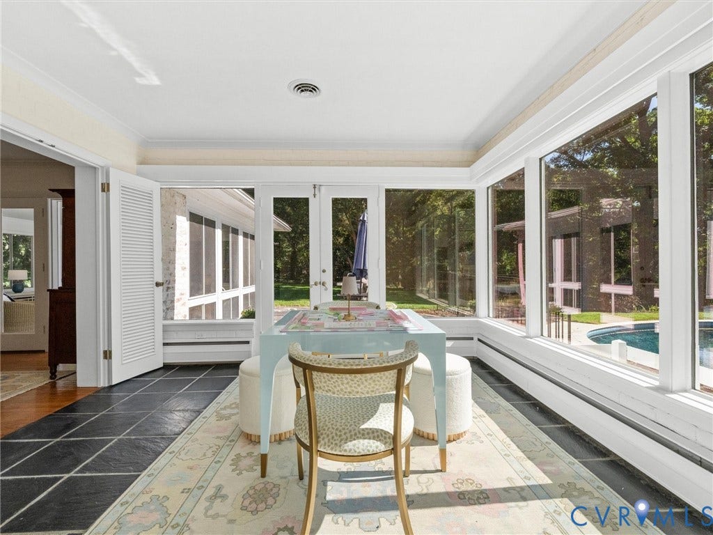 6208 Tapoan Place, Three Chopt, Richmond, VA 23226 Bright sunroom featuring expansive multi-panel windows framing outdoor scenery, slate tile flooring, coffered ceiling with recessed lighting, and French doors opening to the exterior