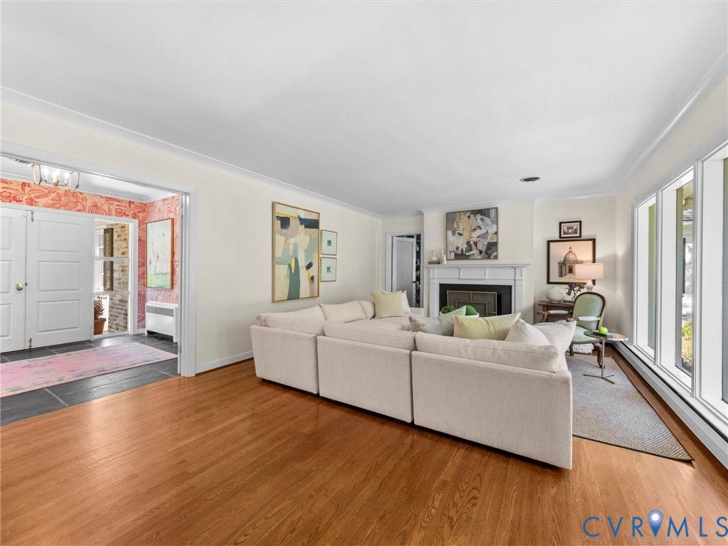 6208 Tapoan Place, Three Chopt, Richmond, VA 23226 Hardwood flooring extending throughout, a fireplace with a classic mantel, and multiple large windows