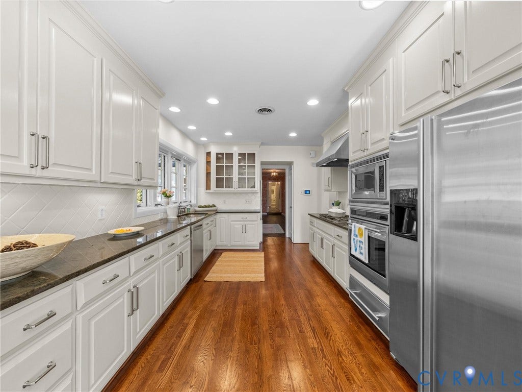 6208 Tapoan Place, Three Chopt, Richmond, VA 23226 Galley kitchen featuring hardwood flooring, white cabinetry, dark countertops, stainless steel appliances, and recessed lighting