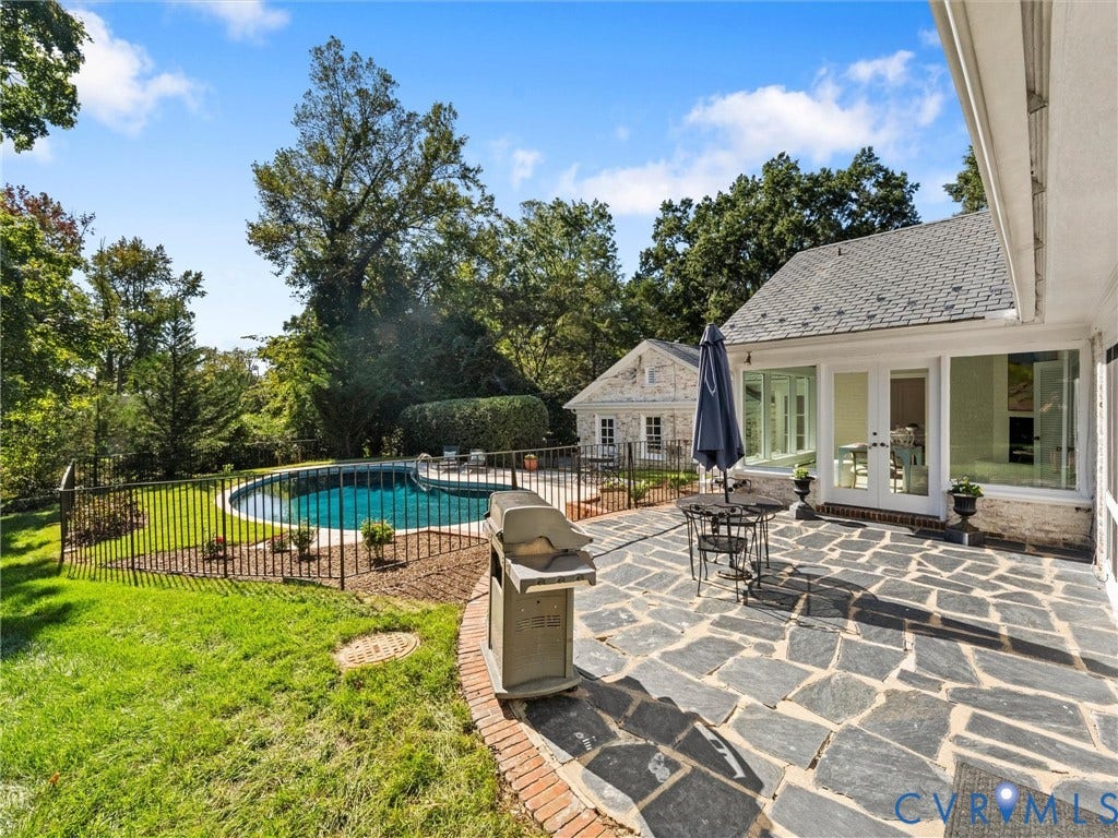 6208 Tapoan Place, Three Chopt, Richmond, VA 23226 Expansive outdoor patio with irregular flagstone paving, a curved brick border, and direct access to the interior via double French doors