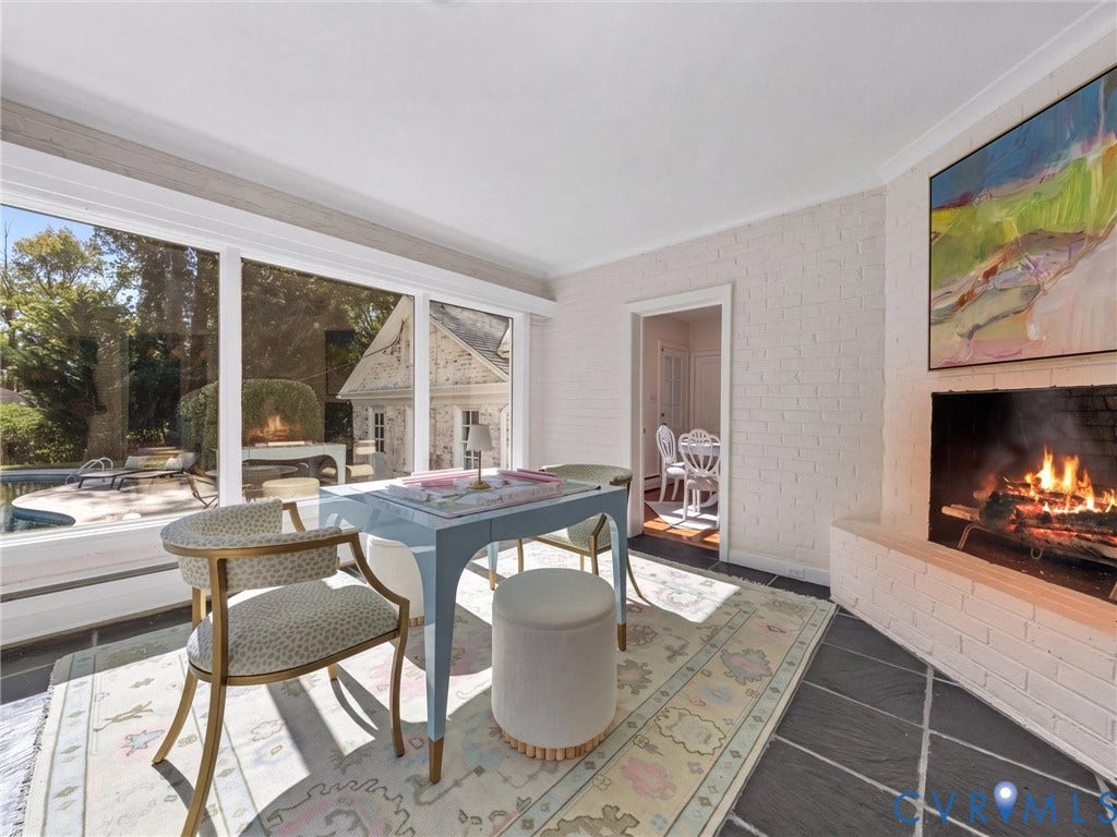 6208 Tapoan Place, Three Chopt, Richmond, VA 23226 Floor-to-ceiling windows, white painted brick fireplace, and dark tile flooring