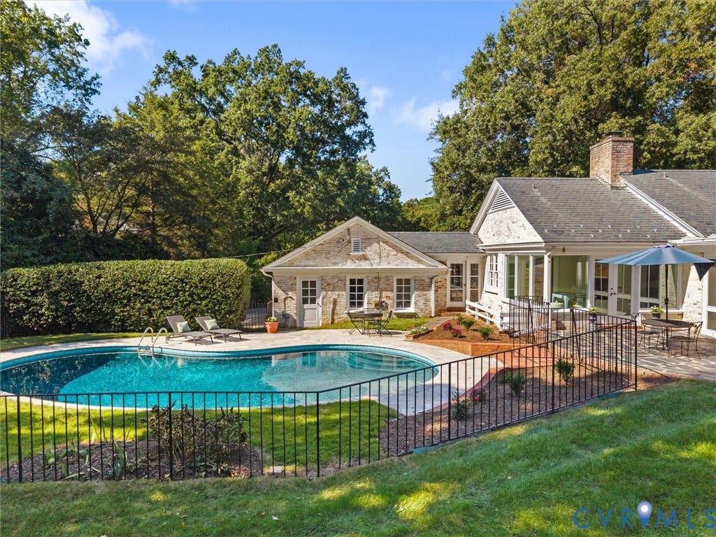 6208 Tapoan Place, Three Chopt, Richmond, VA 23226 Private backyard oasis featuring a freeform swimming pool, extensive stone patio, and a dedicated pool house