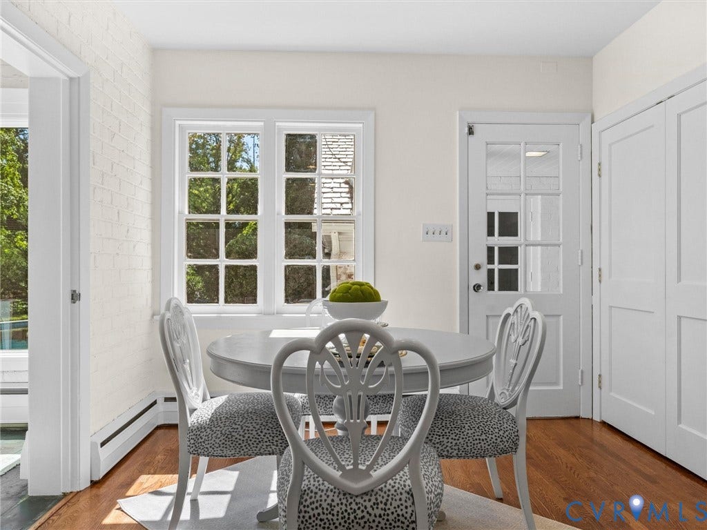 6208 Tapoan Place, Three Chopt, Richmond, VA 23226 Hardwood flooring, painted brick wall, white trim work, two-panel window, and a glass-paneled door