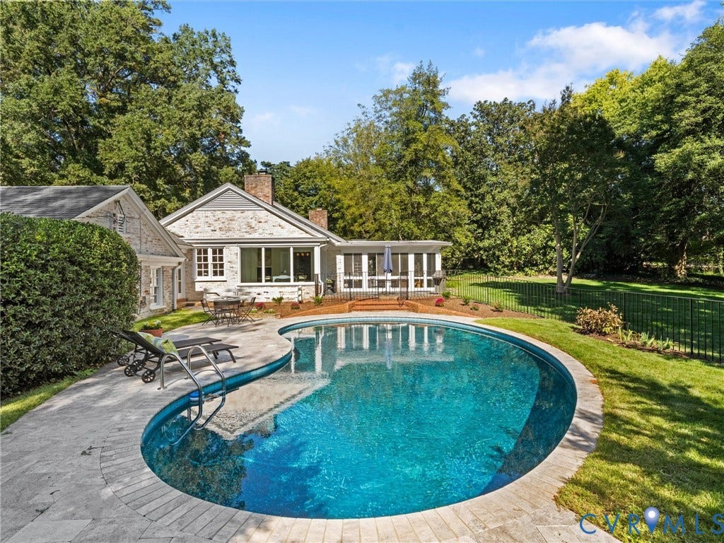 6208 Tapoan Place, Three Chopt, Richmond, VA 23226 Expansive backyard oasis featuring a resort-style saltwater pool with curved edges and integrated sun shelf, surrounded by a composite decking area and mature landscaping