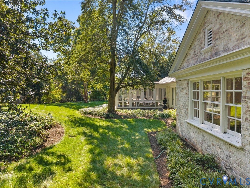 6208 Tapoan Place, Three Chopt, Richmond, VA 23226 Painted brick exterior with multiple pane windows, a covered porch, established trees, and manicured landscaping