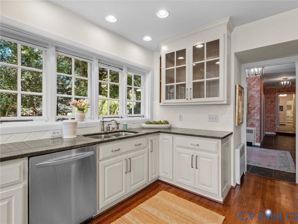 6208 Tapoan Place, Three Chopt, Richmond, VA 23226 White paneled cabinetry with glass-front uppers, stainless steel appliance, recessed lighting, and rich wood-finish flooring