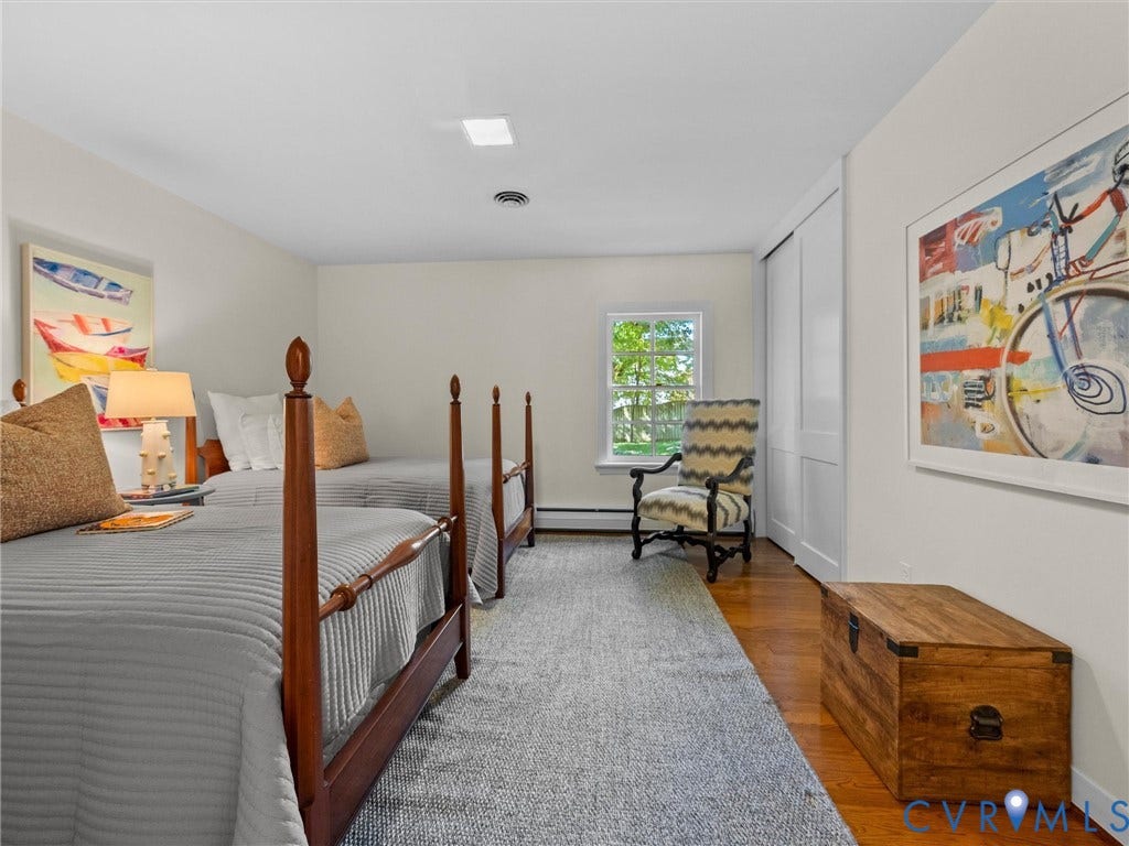 6208 Tapoan Place, Three Chopt, Richmond, VA 23226 Hardwood flooring, white walls, window with natural light, recessed ceiling lighting, and built-in closet with sliding doors