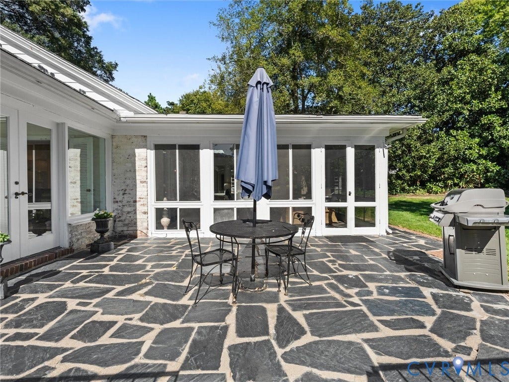 6208 Tapoan Place, Three Chopt, Richmond, VA 23226 Expansive flagstone patio with a white brick exterior and a screened porch