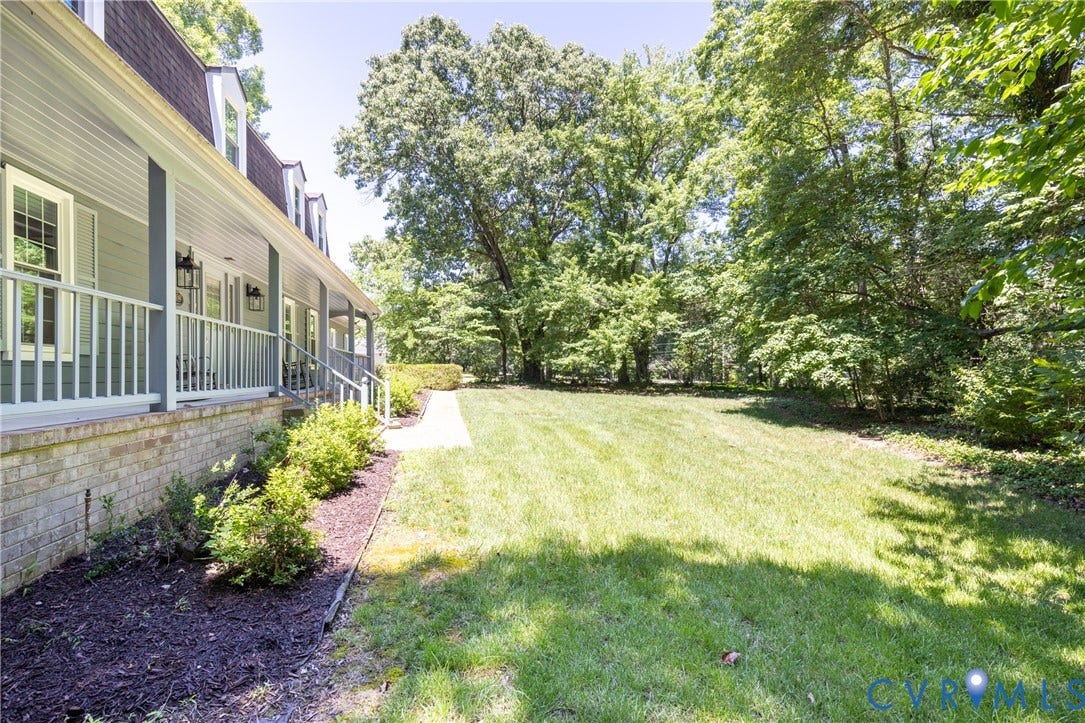 Expansive lawn area with mature trees