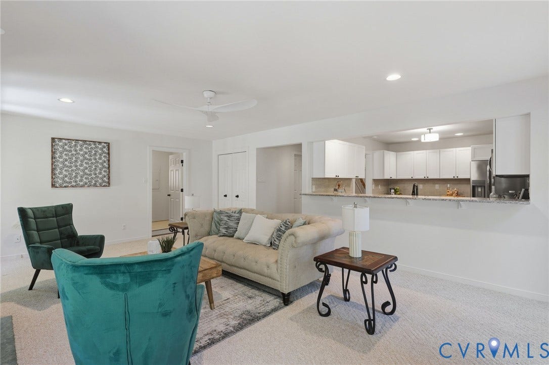 Family room open to kitchen and laundry room/mud room beyond to garage