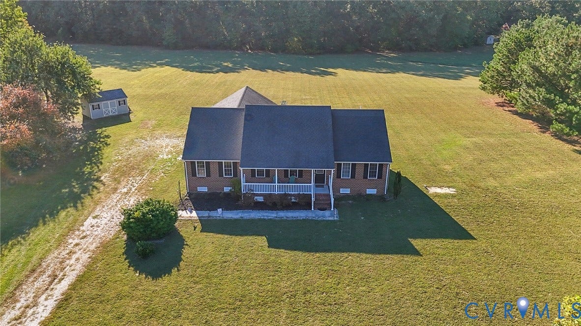 20550 Horseshoe Road, Prince George, VA 23830 Brick residence with a covered front porch and dark shutters