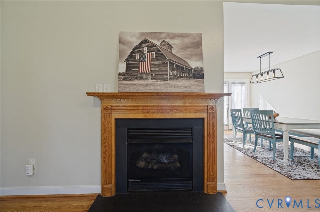 20550 Horseshoe Road, Prince George, VA 23830 Fireplace with a detailed wood mantel and dark hearth