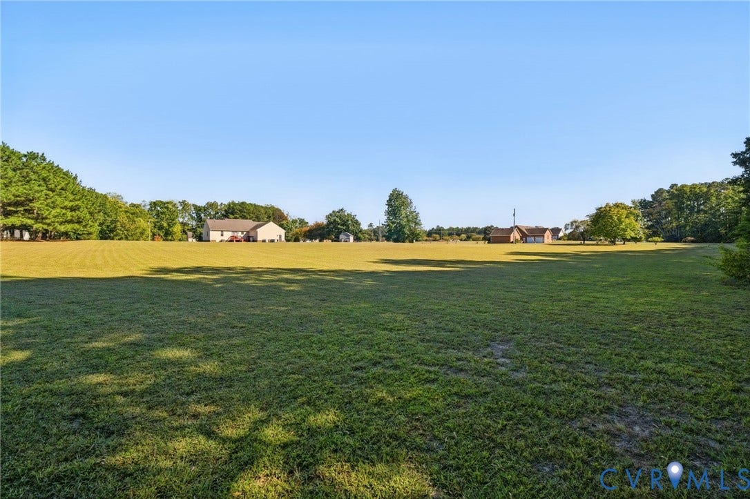 20550 Horseshoe Road, Prince George, VA 23830 Expansive green space featuring a large grassy area and distant residential structures