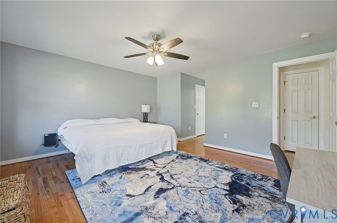 20550 Horseshoe Road, Prince George, VA 23830 Hardwood flooring throughout, light gray wall finishes, and a ceiling fan with integrated lighting