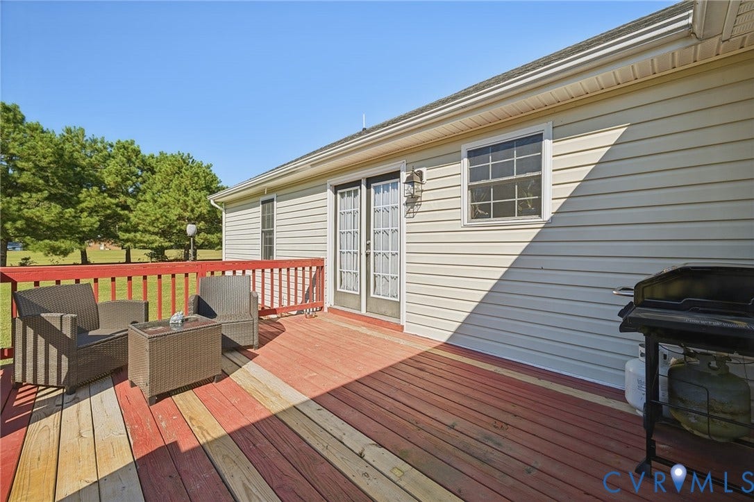 20550 Horseshoe Road, Prince George, VA 23830 Expansive outdoor deck with wood flooring and a red railing