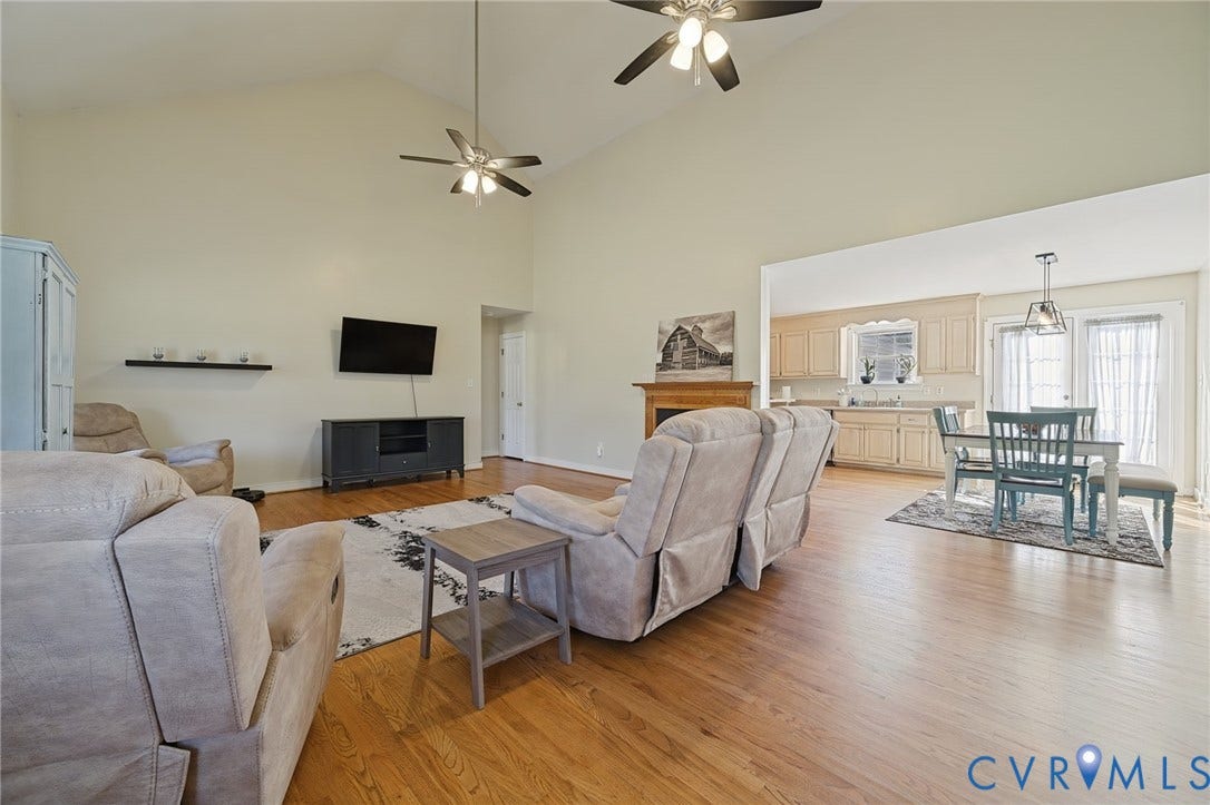 20550 Horseshoe Road, Prince George, VA 23830 Vaulted ceilings, wood-finish flooring, two ceiling fans, built-in fireplace, and kitchen pass-through