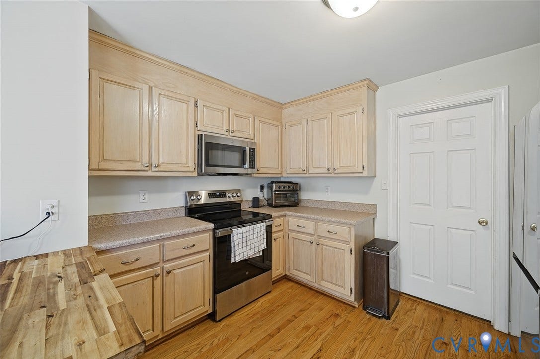 20550 Horseshoe Road, Prince George, VA 23830 Kitchen featuring wood cabinetry, stainless steel range, and wood-finish flooring