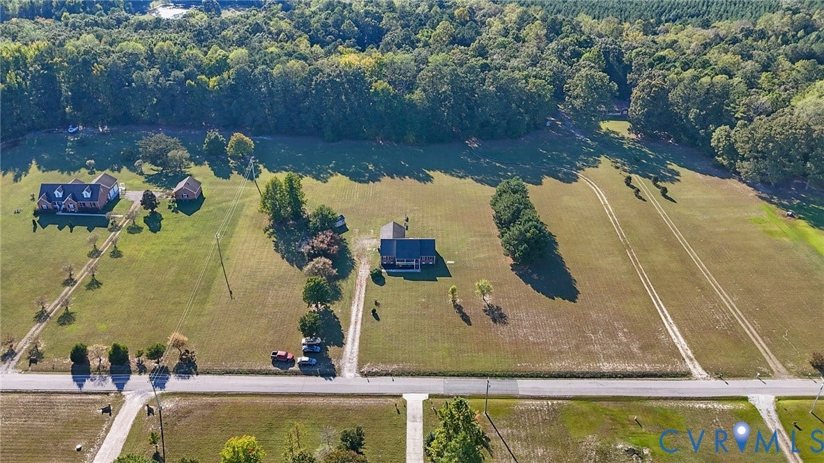 20550 Horseshoe Road, Prince George, VA 23830 Expansive lot featuring a residential structure, mature perimeter trees, and a visible roadway