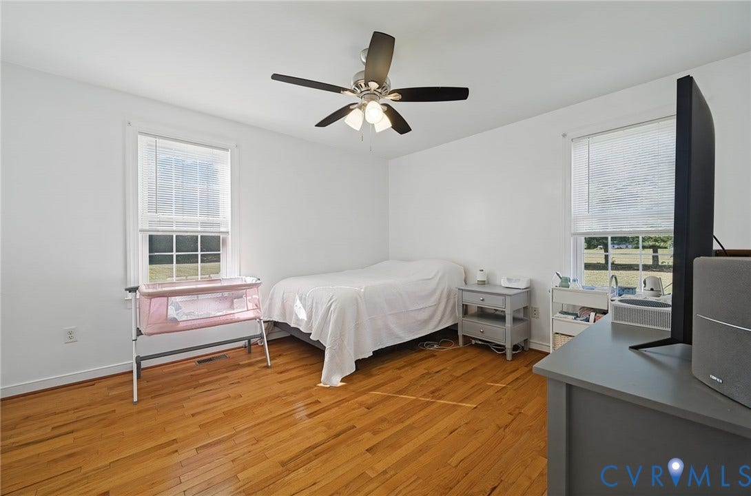 20550 Horseshoe Road, Prince George, VA 23830 Hardwood flooring, white painted walls, and a ceiling fan with integrated lighting
