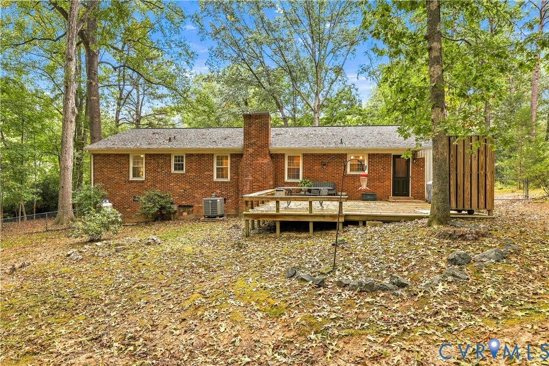 Brick exterior with a wood-plank deck