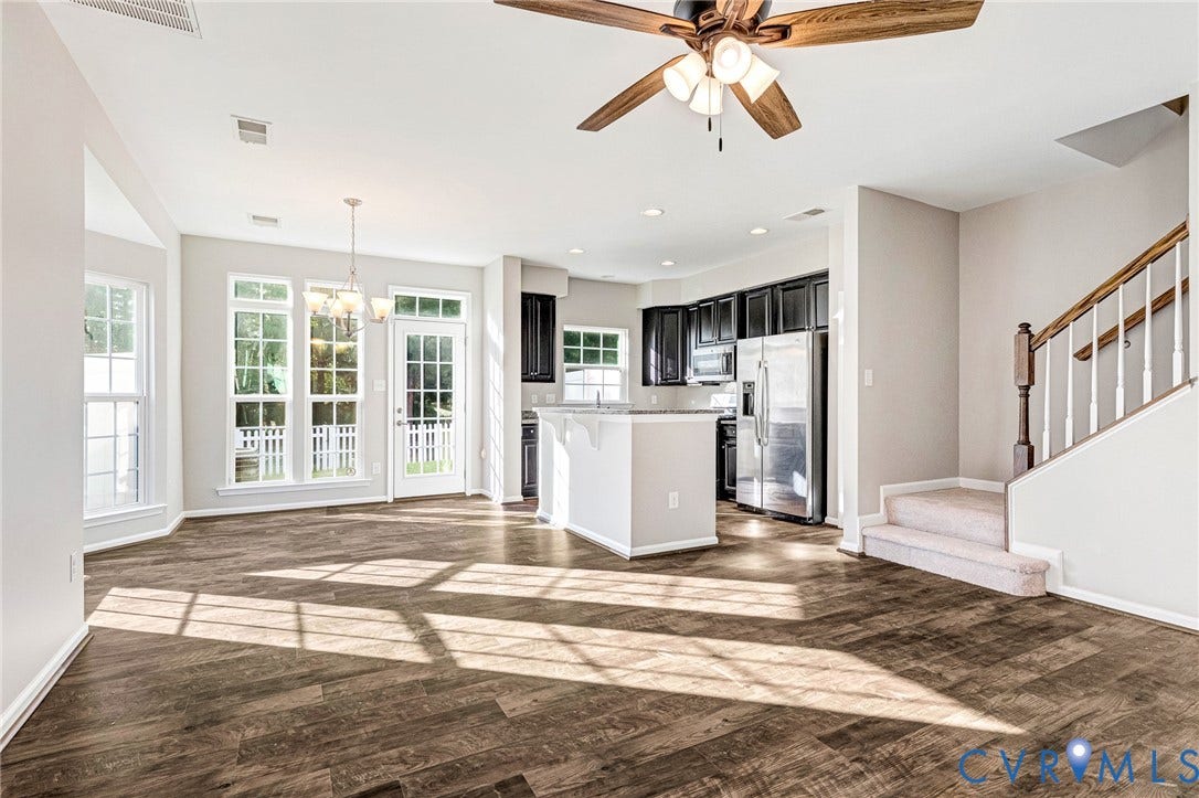 8926 Ringview Drive, Mechanicsville, VA 23116 Wood-finish flooring, white paneled doors, recessed lighting, ceiling fan, and a staircase with a carpeted runner