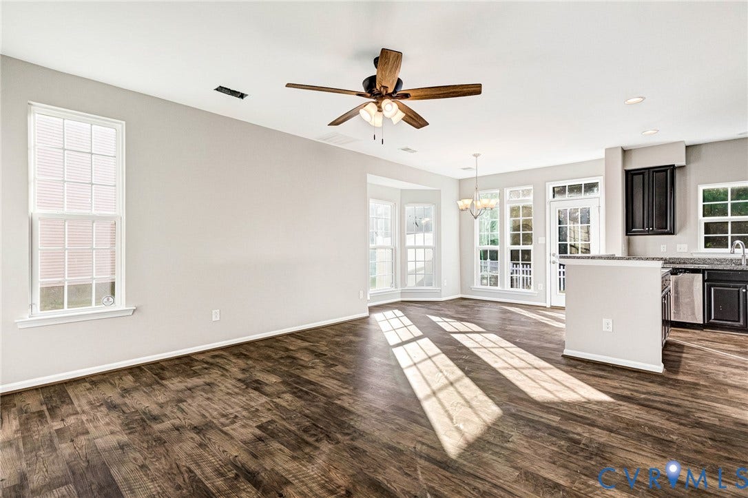 8926 Ringview Drive, Mechanicsville, VA 23116 Wood-finish flooring, multiple large windows, bay window, ceiling fan, and recessed lighting