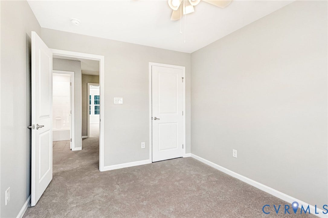 8926 Ringview Drive, Mechanicsville, VA 23116 Carpeted room with light gray walls, white trim, and a ceiling fan