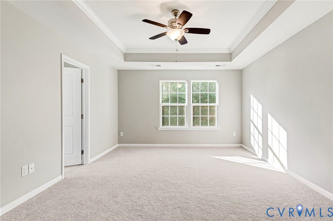 8926 Ringview Drive, Mechanicsville, VA 23116 Recessed tray ceiling with crown molding, double windows, and light-toned carpet flooring