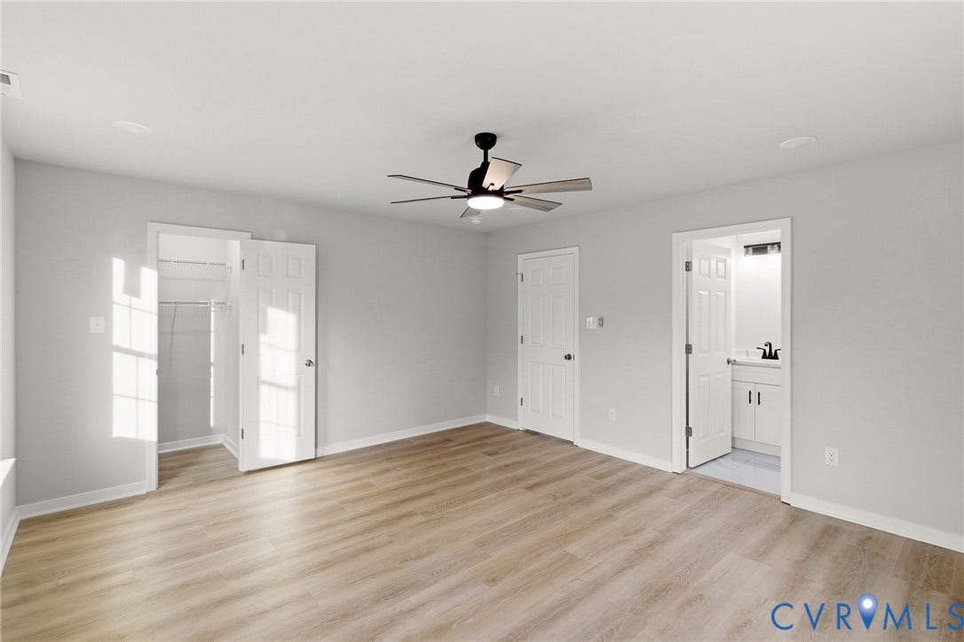 Wood-finish flooring throughout, ceiling fan with integrated lighting, recessed lighting, and a closet with bifold doors