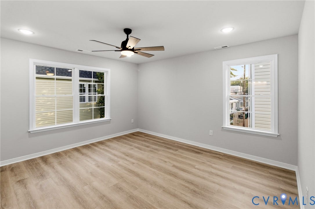 Light wood-finish flooring, recessed lighting, and a ceiling fan with light fixture