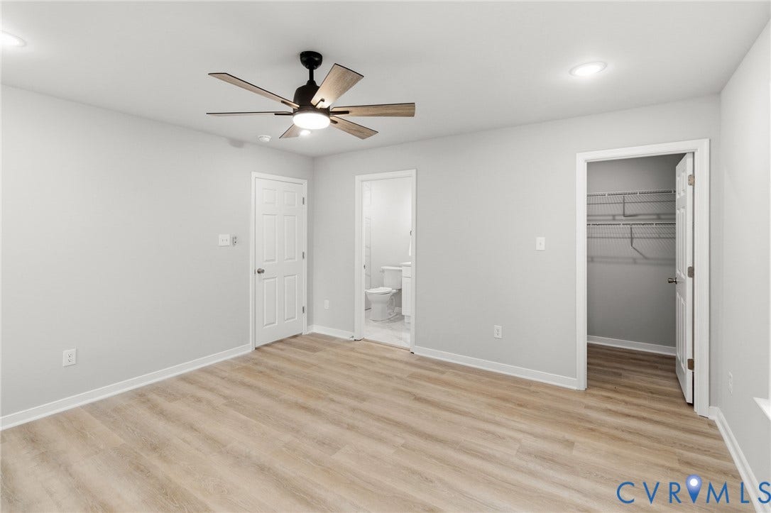 Wood-finish flooring, recessed lighting, ceiling fan with light, white paneled doors, and closet with wire shelving
