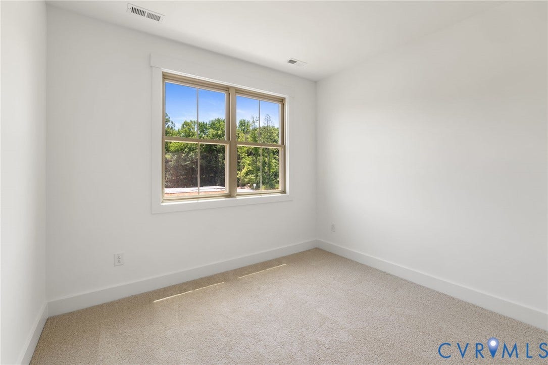 9514 Angels Share Drive, New Kent, VA 23141 Light-colored carpeting, white walls, and a large window with white trim